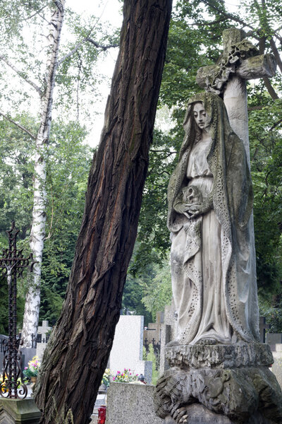 Ancient sculpture of angel on cemetery