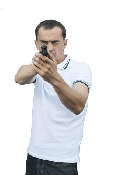 Ein Mann zielt mit einer Waffe — Stockfoto