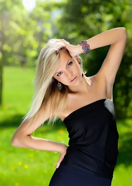 Beautiful girl in the little black dress — Stock Photo, Image
