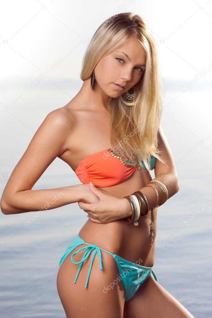 Girl with blond hair in a swimsuit
