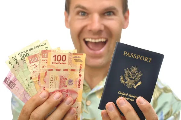 Tourist with pesos and passport — Stock Photo, Image