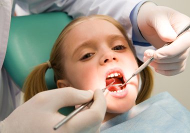 Child at the dentistry clipart