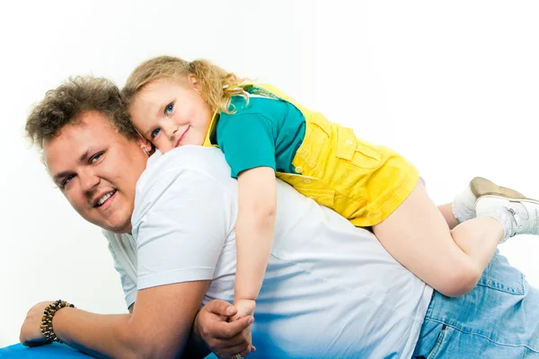 Father and his daughter lying on the bad — Stock Photo, Image