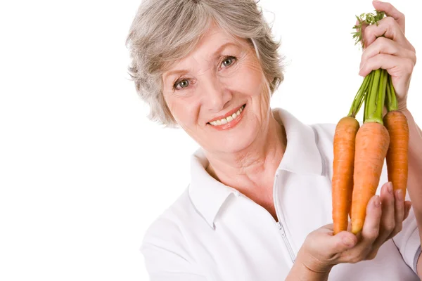 Фермер с морковью — стоковое фото