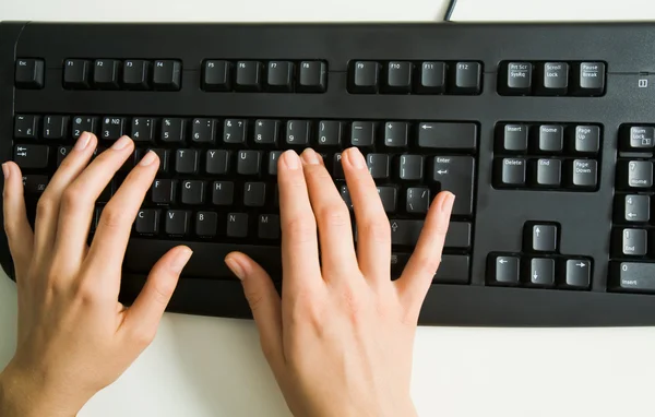 Hands over keyboard — Stock Photo, Image