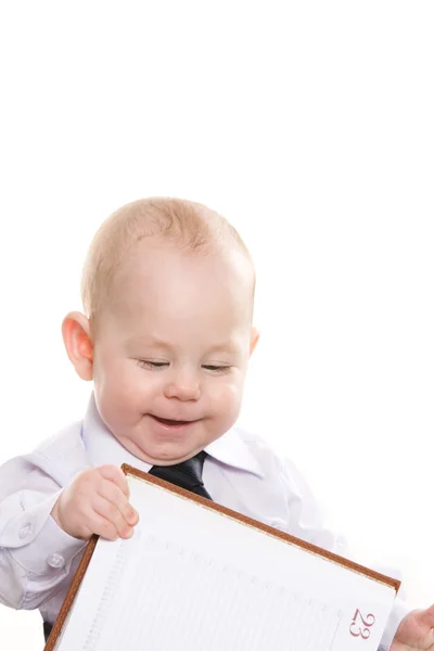 Baby with notepad — Stock Photo, Image