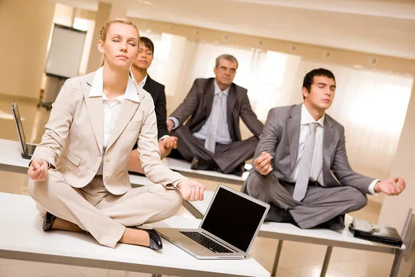 Meditating business partners — Stock Photo, Image