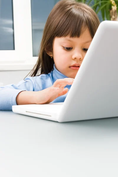 Childs palm over computer keyboard — Stock Photo, Image