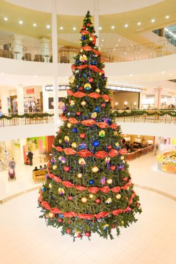 Decorated tree in the trade center clipart