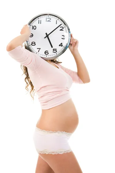 stock image Pregnant female with clock