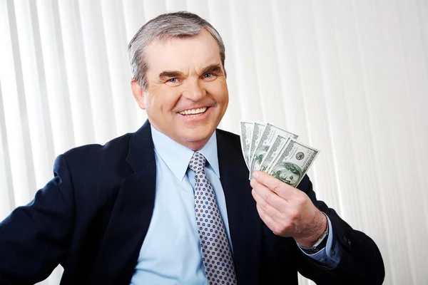 Muž s dolary — Stock fotografie