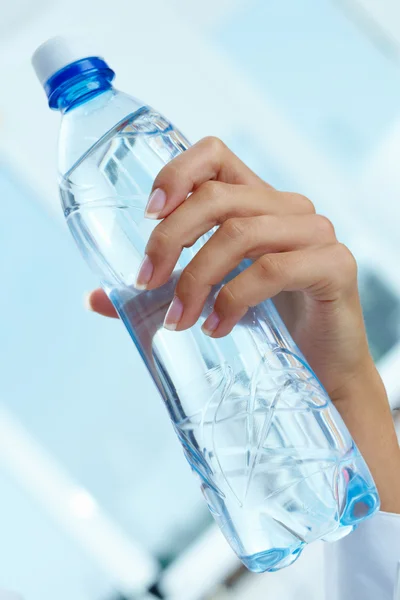 Bottle in hand — Stock Photo, Image