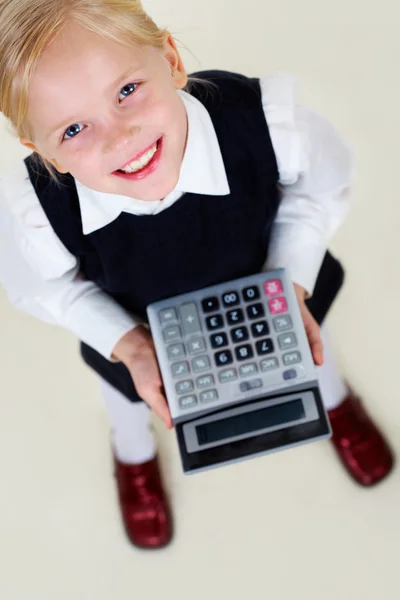 Girl with calculator Royalty Free Stock Images