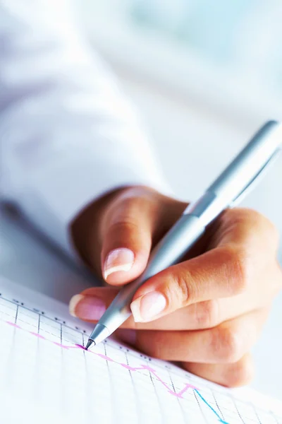 Hand with pen Stock Image