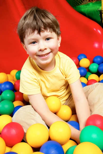 Boy in balls — Stock Photo, Image