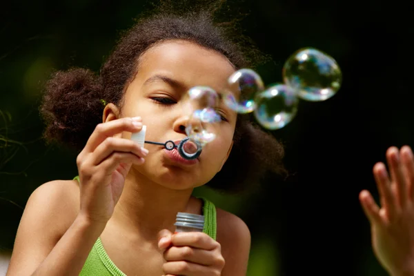 Blowing soap bubbles — Stock Photo, Image
