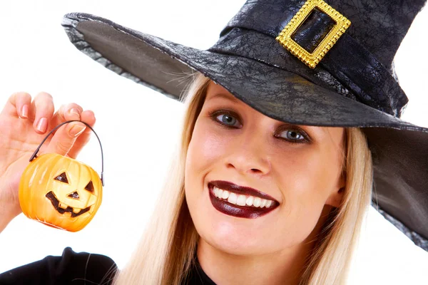 Witch with pumpkin candle — Stock Photo, Image