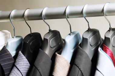 Hangers with suits clipart