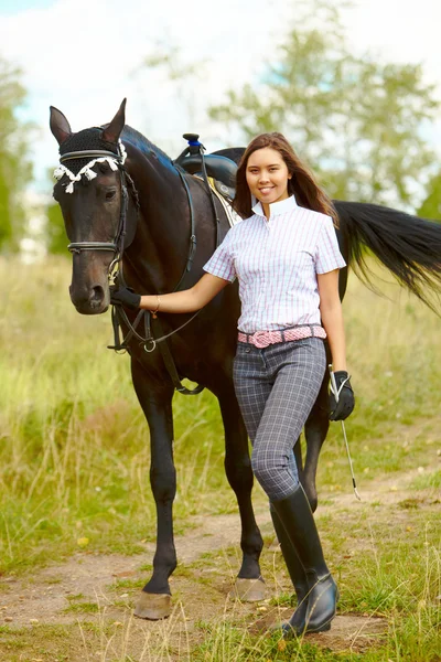 Brunette with horse — Stock Photo, Image