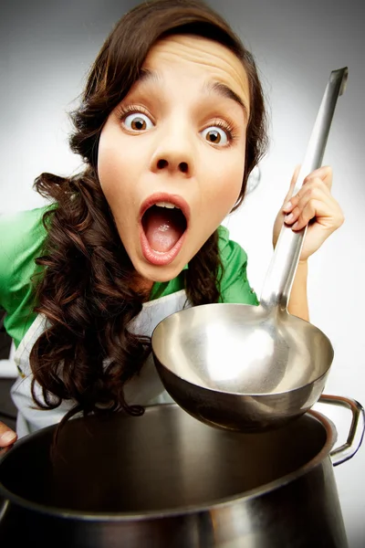 Girl with a ladle — Stock Photo, Image