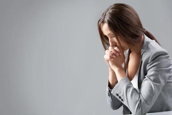Praying businesswoman — Stock Photo, Image