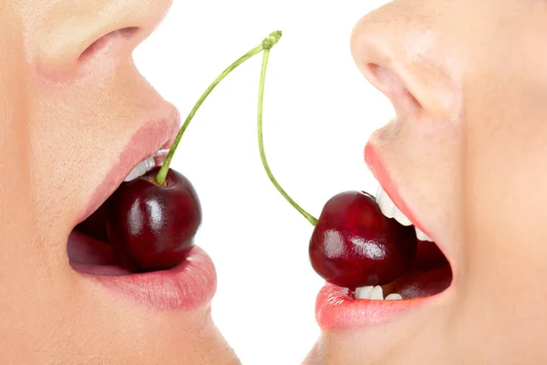 Cherry in mouths — Stock Photo, Image