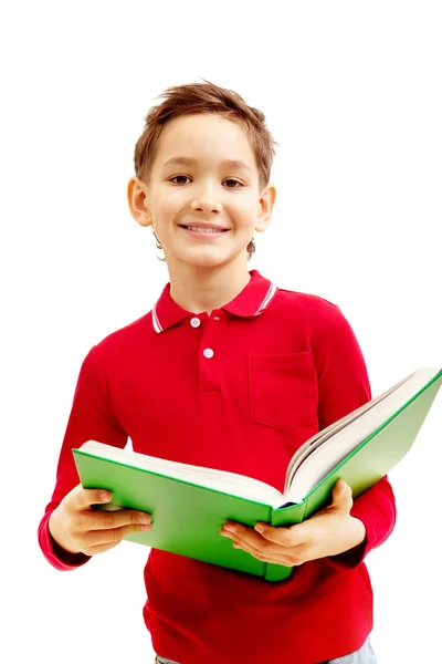Мальчик с учебником — стоковое фото
