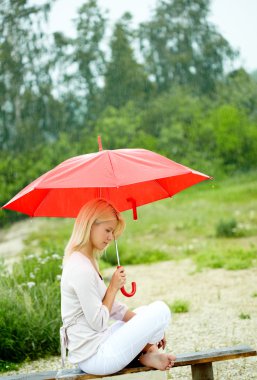 Girl under umbrella clipart