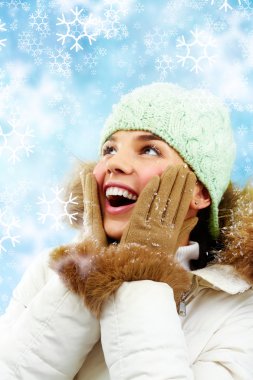 Surprised woman in winter clothes clipart