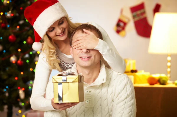 Portrait of happy woman closing male's eyes — Stock Photo, Image