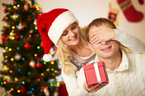 Portrait of happy woman closing male's eyes — Stock Photo, Image