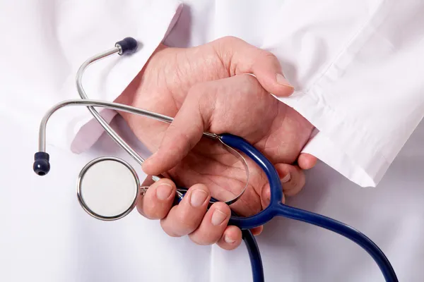 Stethoscope in hands — Stock Photo, Image