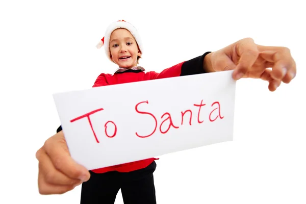 Muchacho feliz sosteniendo carta con nota "A Santa " — Foto de Stock