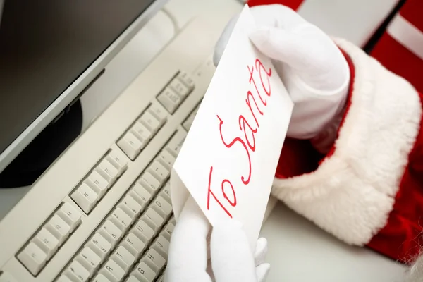 Close-up of Santa hands holding letter — Stock Photo, Image