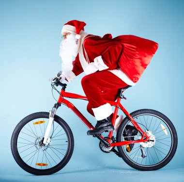 Santa on bike clipart