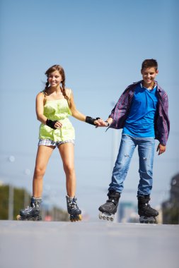 Couple of roller skaters clipart