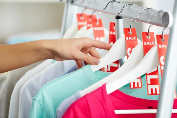 Looking through clothes — Stock Photo, Image