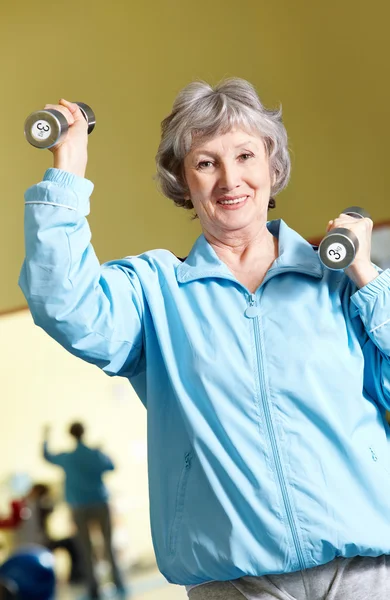 Woman with barbells — Stock Photo, Image