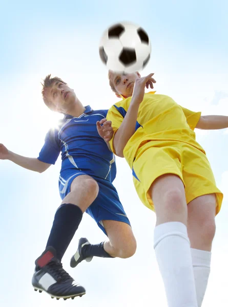 Footballers in jump — Stock Photo, Image