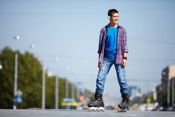 Lad on roller skates — Stock Photo, Image