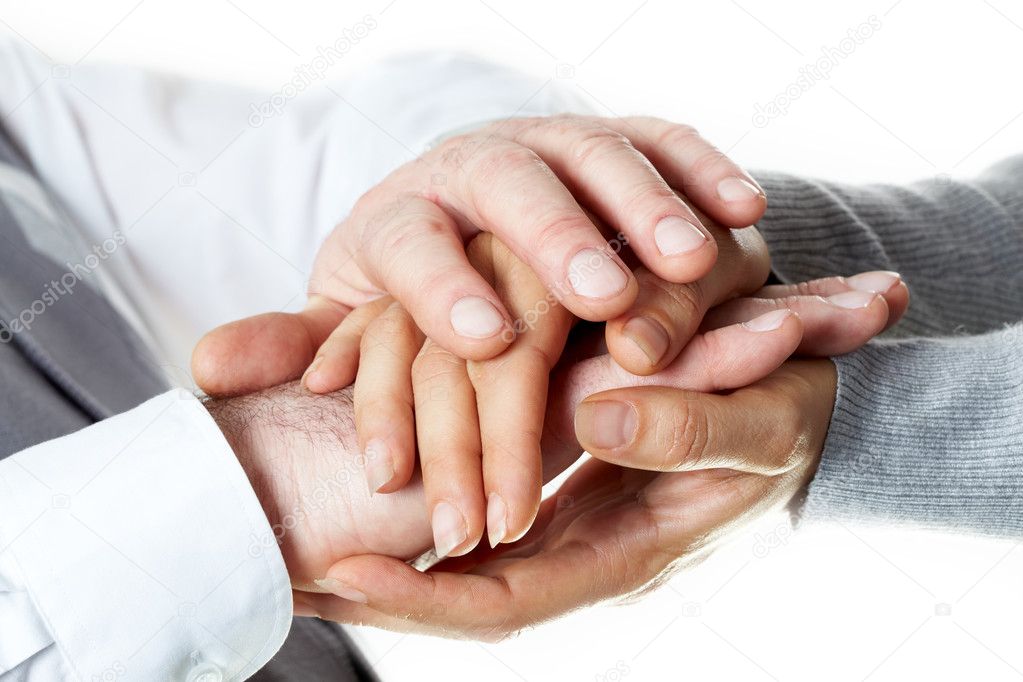 Photo of male and female hands holding each other