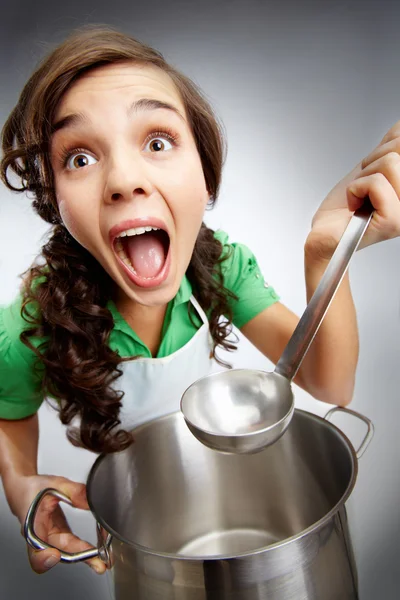 Girl with a ladle — Stock Photo, Image