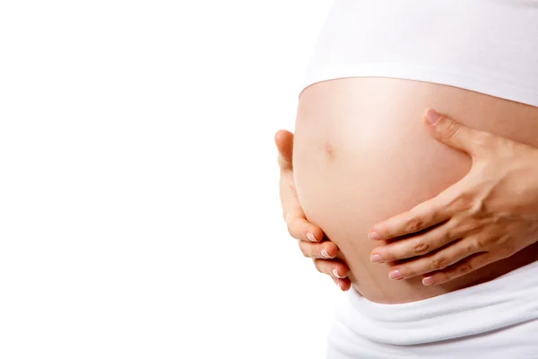 Donna incinta su uno sfondo bianco — Foto Stock
