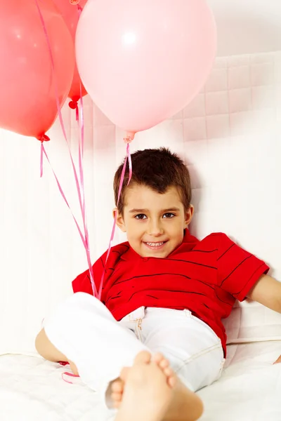 Lad with balloons — Stock Photo, Image