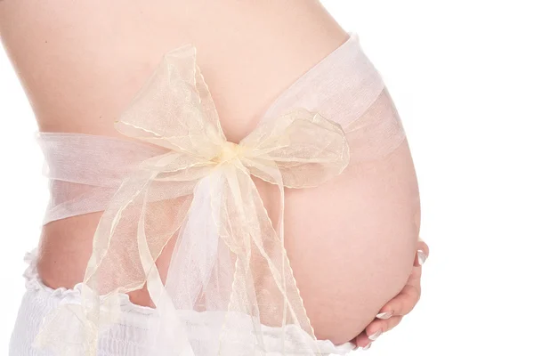 Schöne schwangere Frau in hellem Tuch — Stockfoto