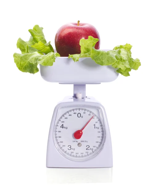 Apfel auf Gewichten — Stockfoto