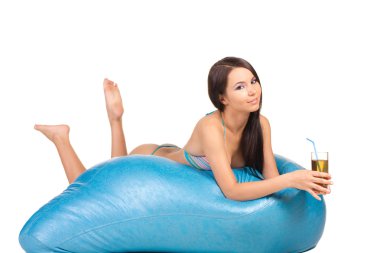 Young woman in blue swimsuit recreation on a blue air matrass clipart