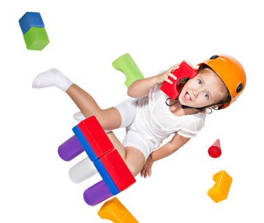 Little girl playing with constructor clipart