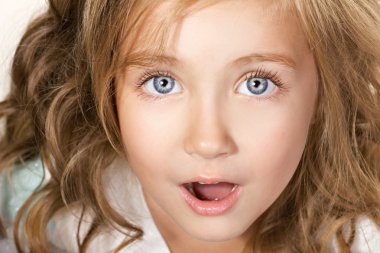 Portarit of an amazed little girl clipart