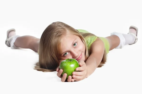 Little girl with an apple — Stock Photo, Image